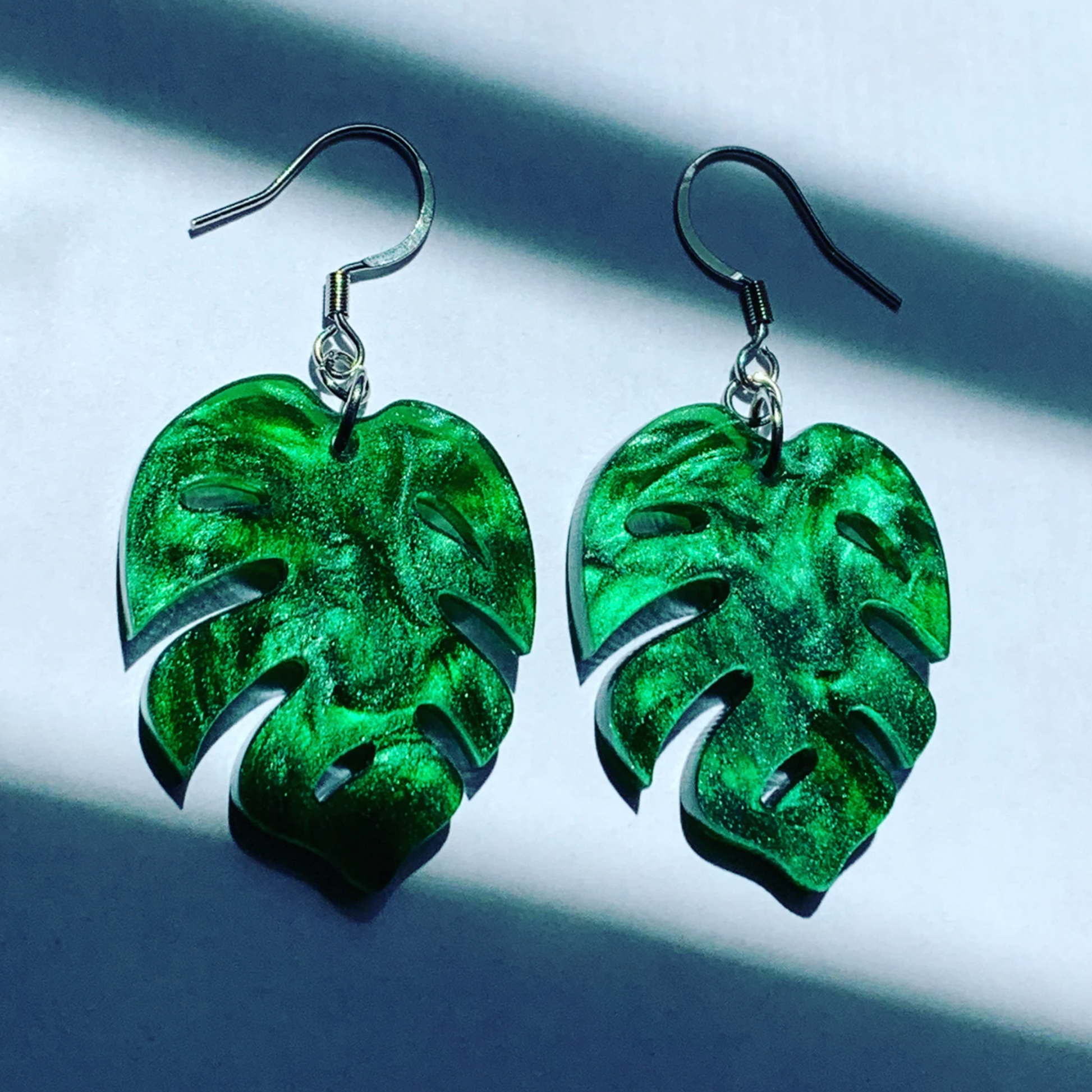 shimmery green acrylic monstera deliciosa 2 inch leaf earrings